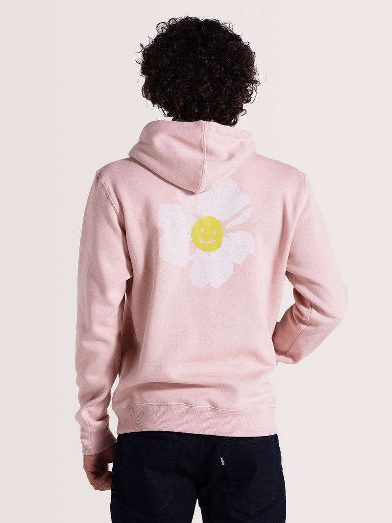 Moletom canguru rosa venice com flor branca e smile amarelo estampados nas costas, capuz ajustável e bolso frontal. Design descontraído e casual.
