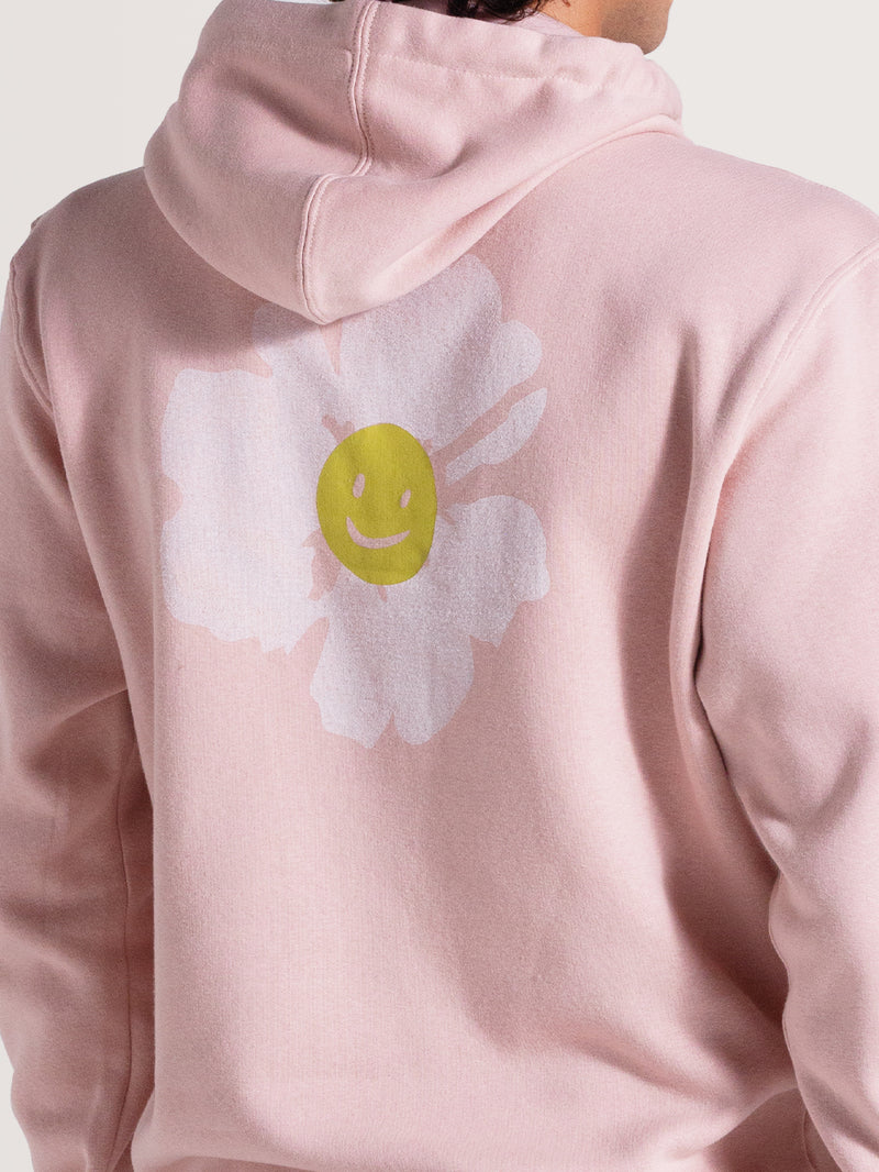 Moletom canguru rosa venice com capuz ajustável e bolso frontal. Nas costas, estampa de flor branca com smile amarelo, criando um visual moderno e descontraído.